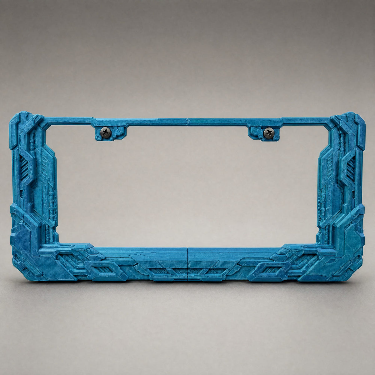 Petrol teal cyberpunk license plate frame on a neutral grey studio backdrop