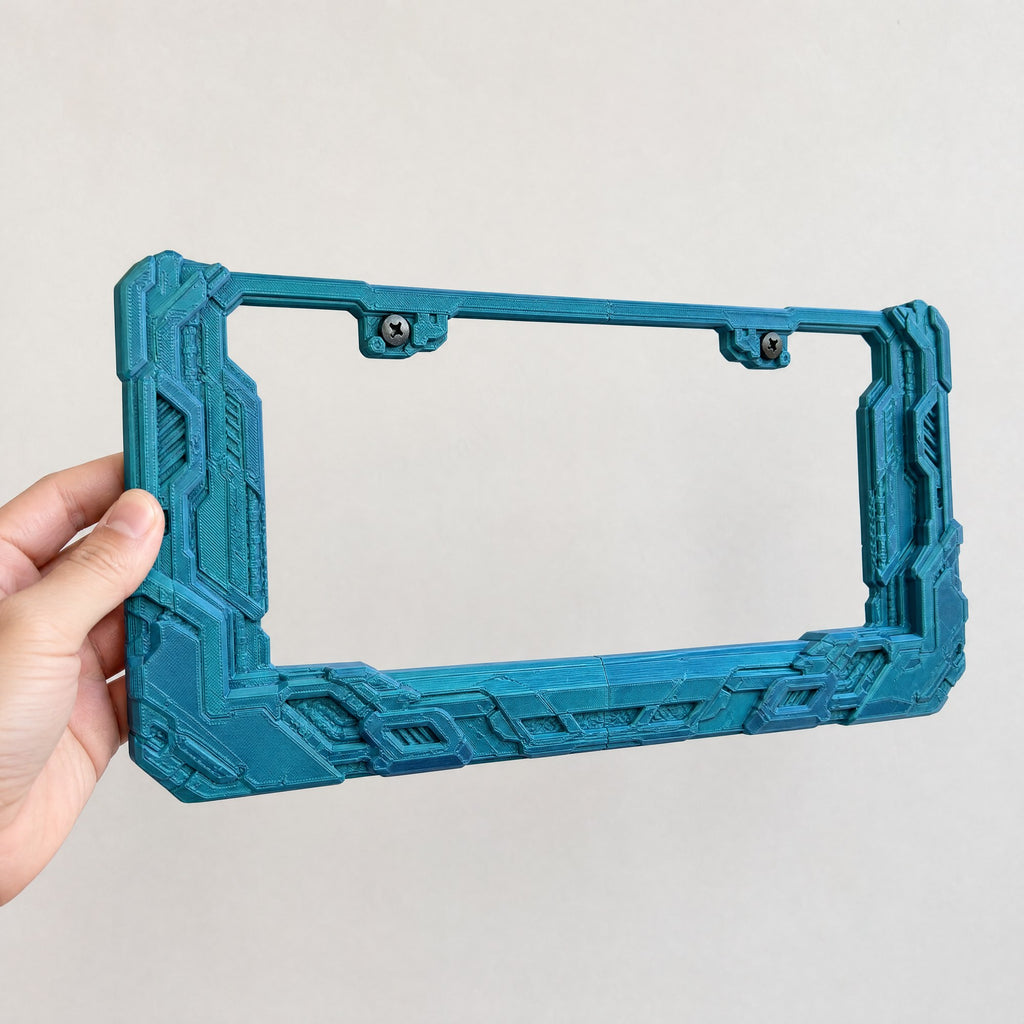 Cyberpunk license plate frame held in a hand to show its size