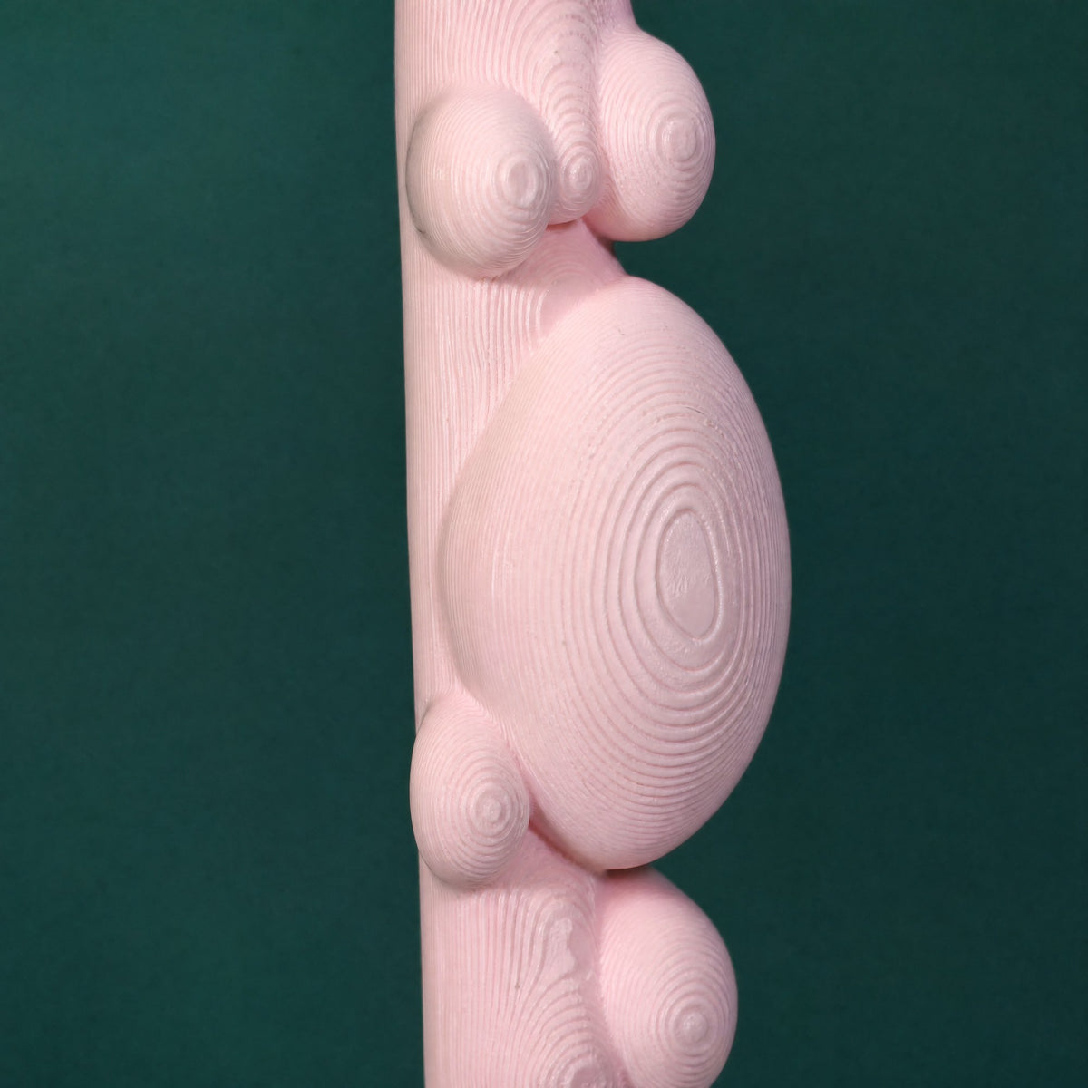 Close-up of the rounded bubble drips and glossy finish in bubblegum pink