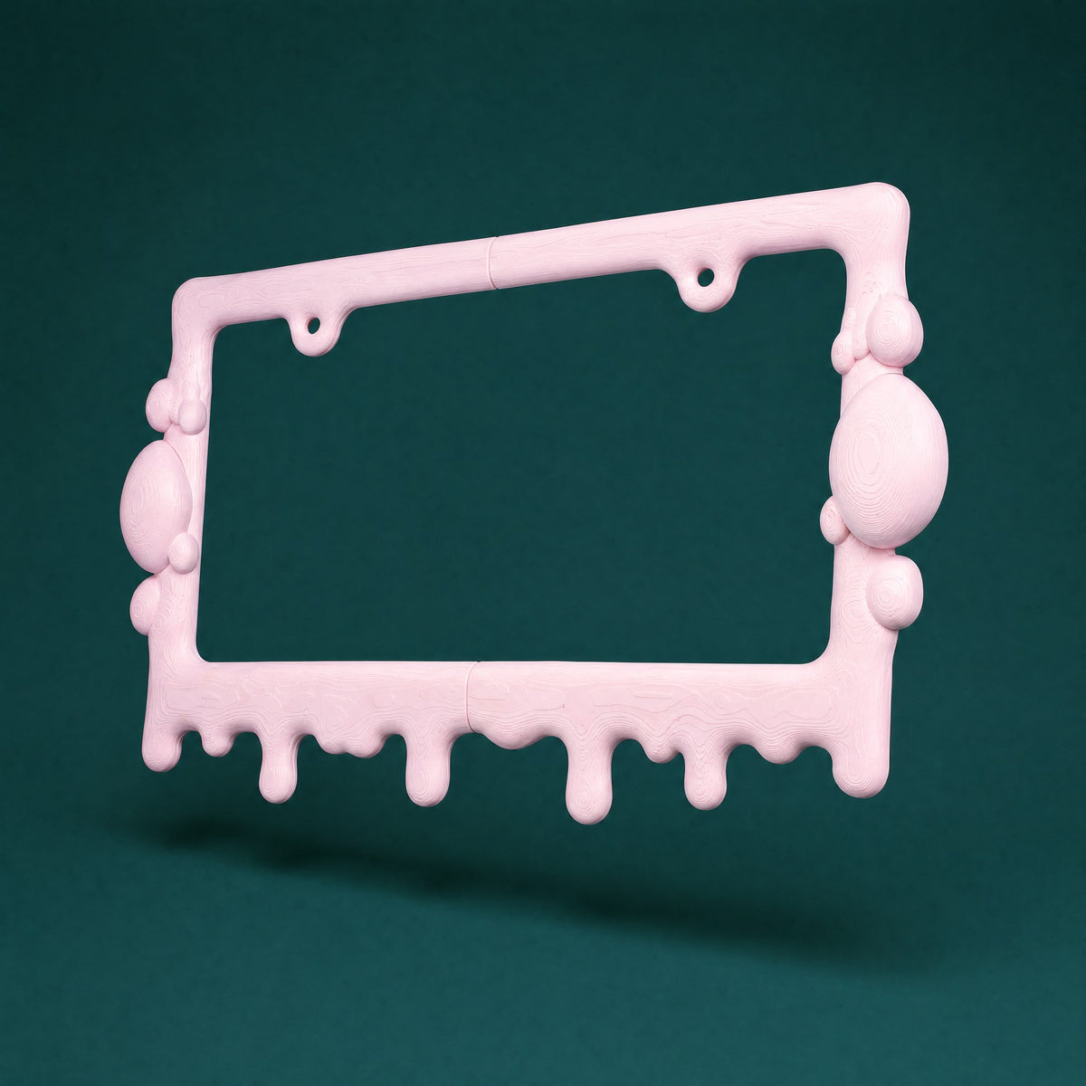 Bubblegum pink slime license plate frame at a three-quarter angle