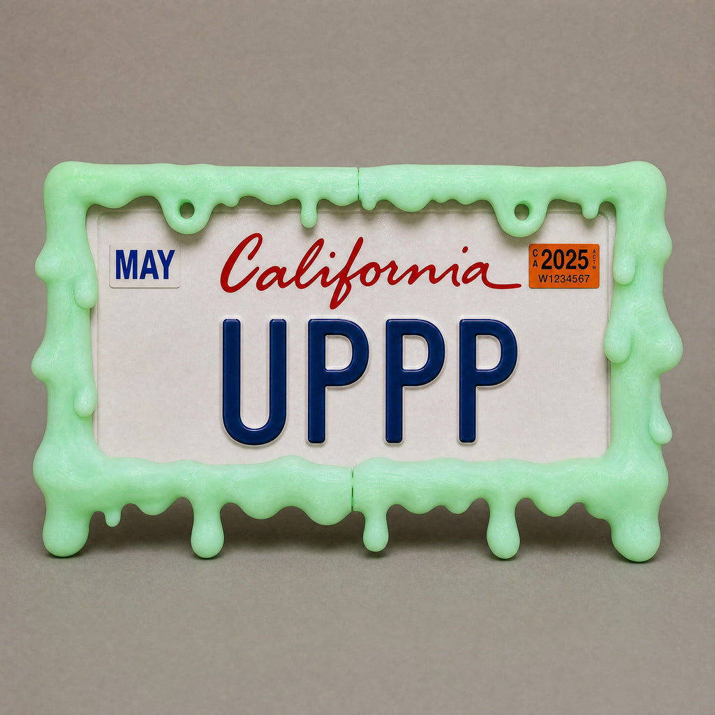 Glow green slime license plate frame held in a hand to show its size