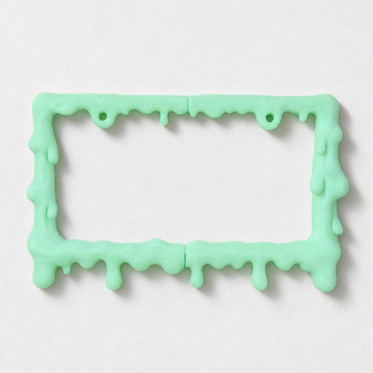 Glow green slime license plate frame with a California plate on white