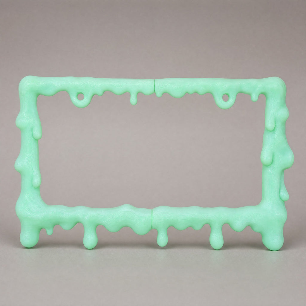 Glow green slime license plate frame at a three-quarter angle