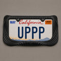 Black draped license plate frame holding a California UPPP plate on a grey background