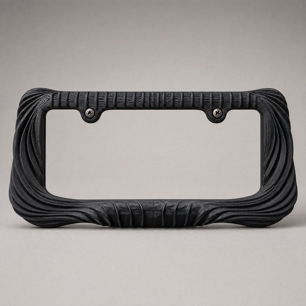 Black draped license plate frame straight on against a grey backdrop