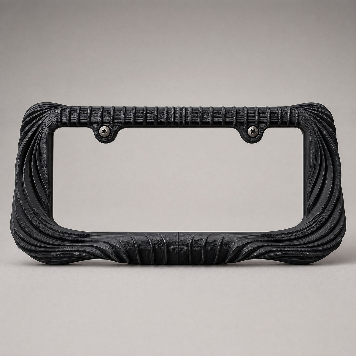 Black draped license plate frame straight on against a grey backdrop