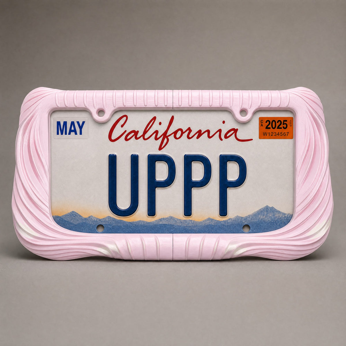 Blush pink draped license plate frame holding a California UPPP plate on a grey background