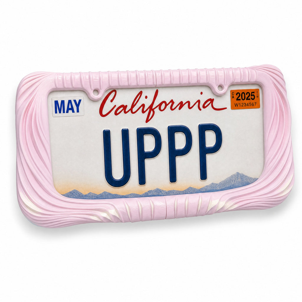 Blush pink Utopia license plate frame with a California plate, three-quarter angled view