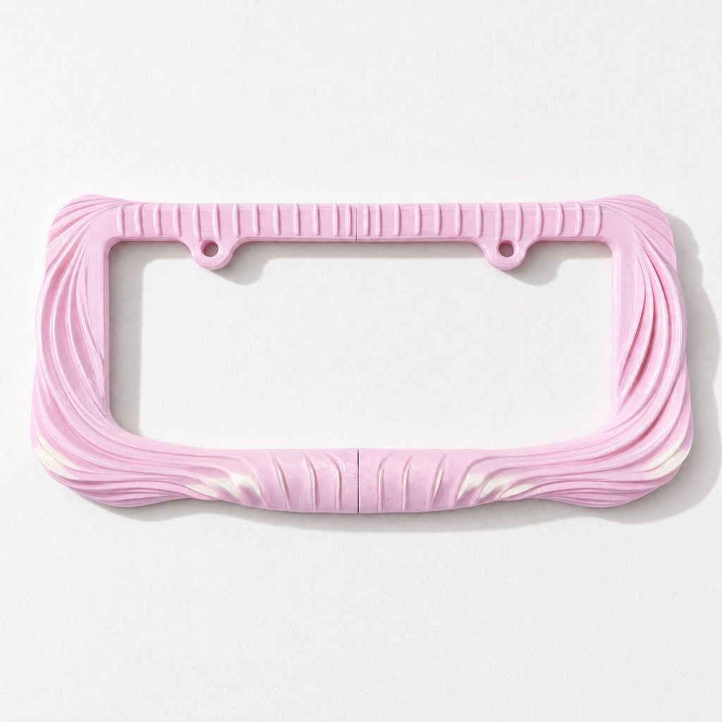 Empty blush pink draped license plate frame on a pale grey background