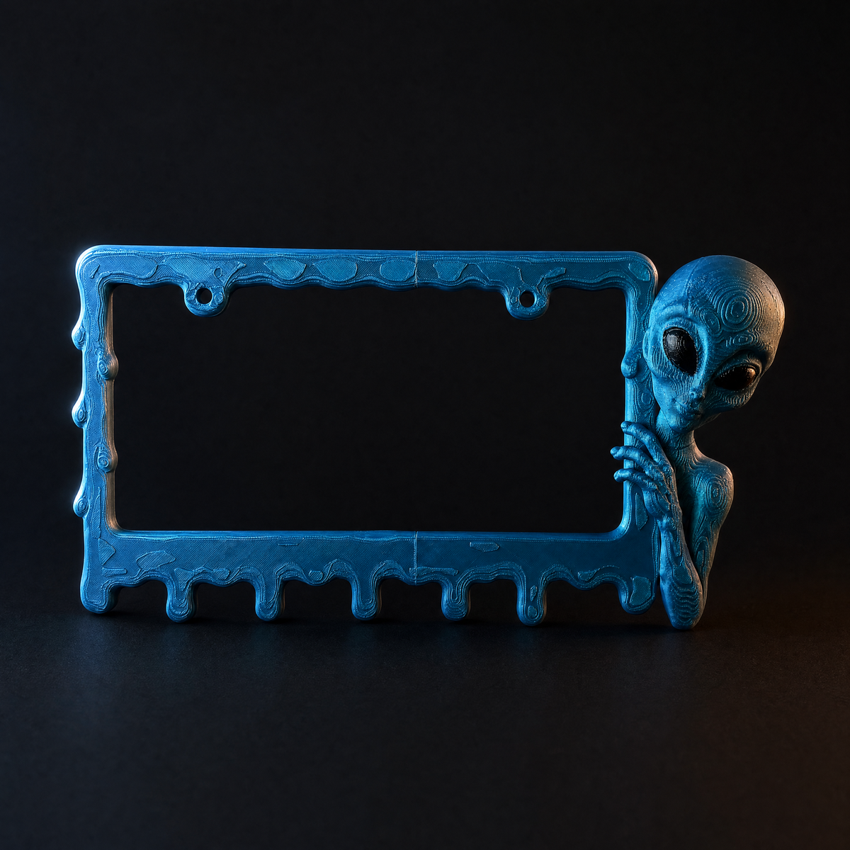 Deep Signal alien frame on a charcoal background with rim lighting