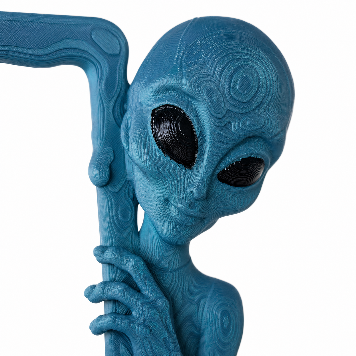 Close-up of the sculpted alien head in translucent Deep Signal blue-green