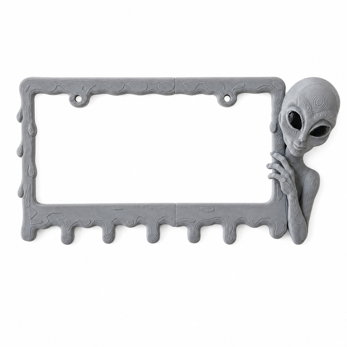 Alien Slime license plate frame in Graphite on pure white studio background