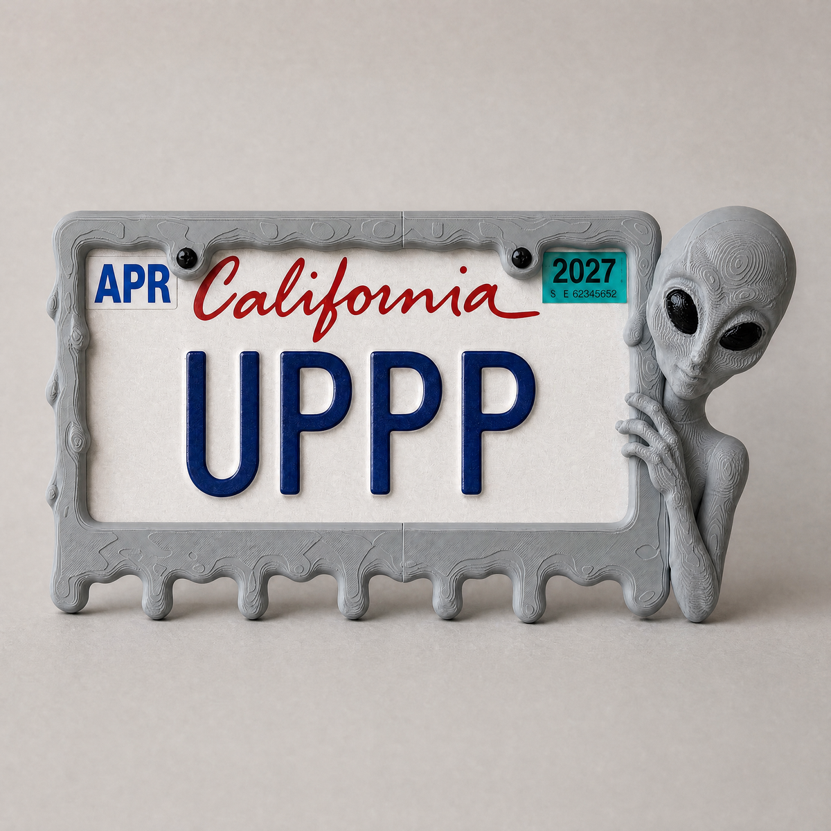 Graphite alien frame with a California plate on a grey backdrop