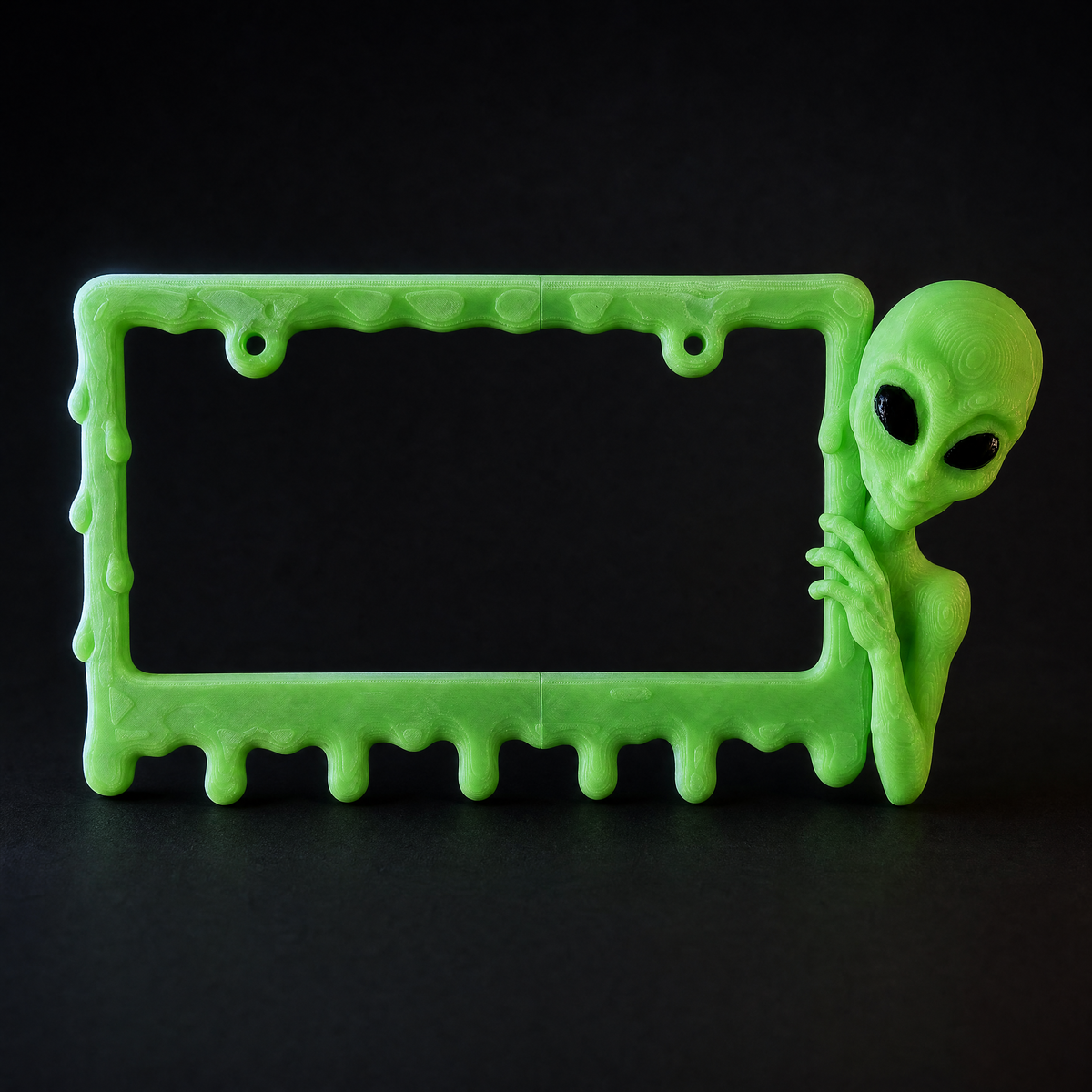 Slime Green alien frame on a charcoal background with rim lighting