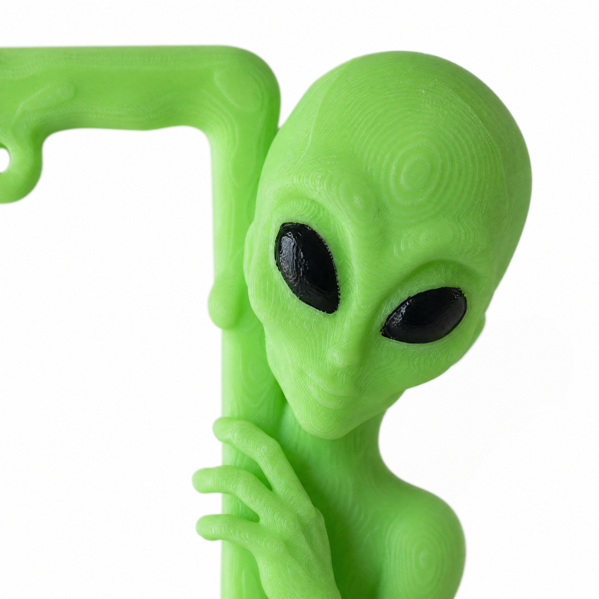 Close-up of the sculpted alien head with hand-painted black eyes