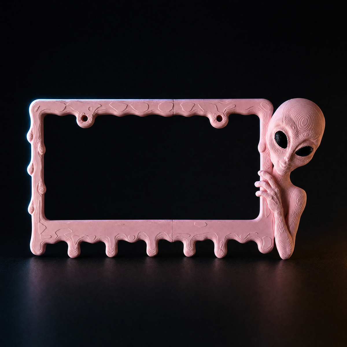 Bubblegum alien frame on a charcoal background with rim lighting