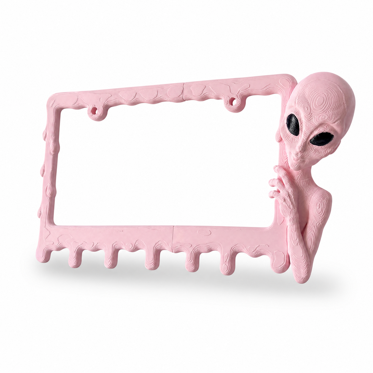 Bubblegum alien frame photographed from above on a clean white surface